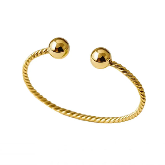 Bracelet Élégance Torsadée – doré, embouts sphériques Harmony & Senteur